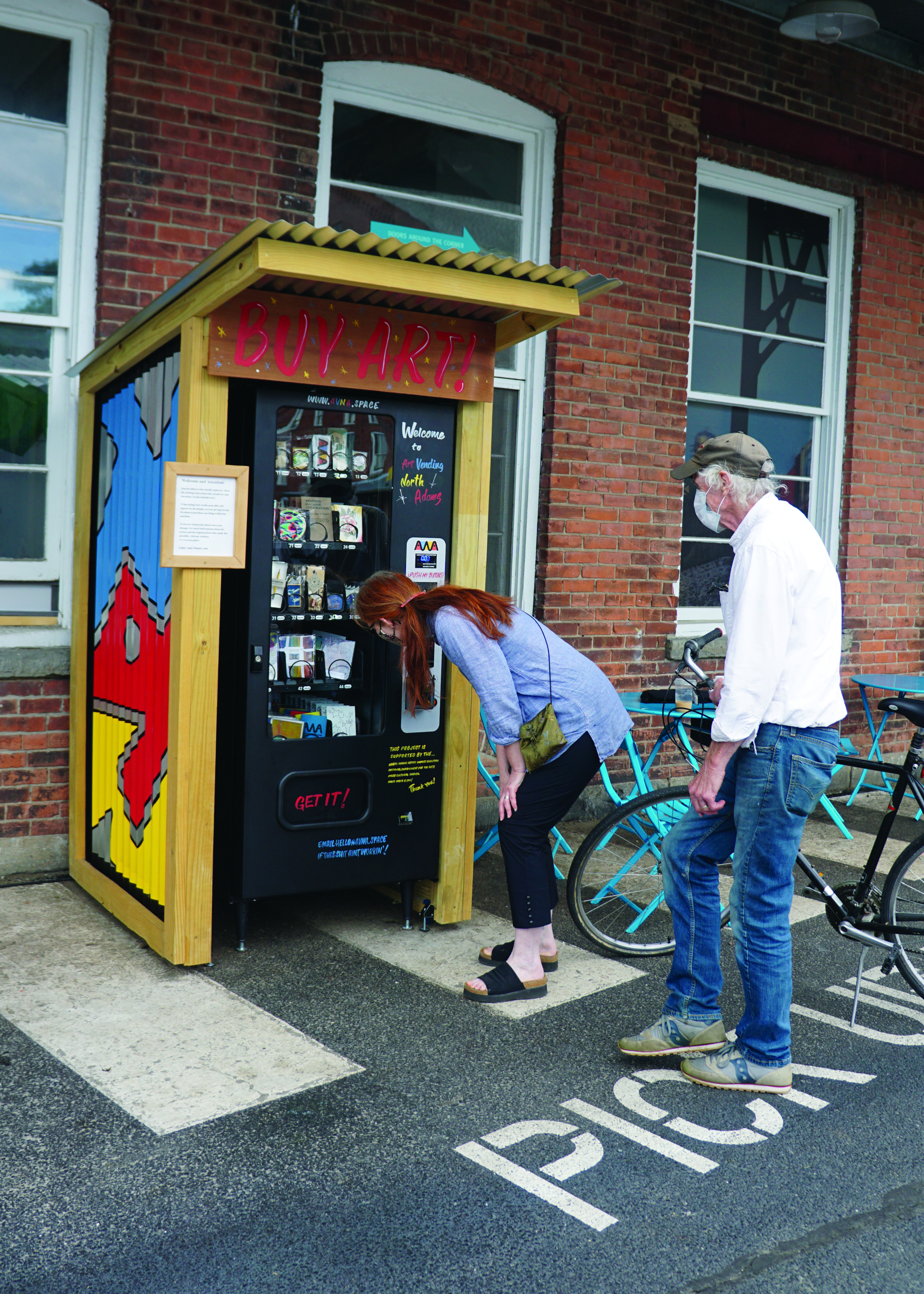 North Adams artist Kathline Carr checks-in on her inventory in Art Vending North Adams with her partner artist Jim Peters.